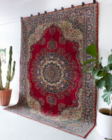 Vintage Turkish rug in a living room setting, pile rug, Turkish rug, vintage rug, portland, rug shop, bright colors, wild shaman, soft rug, bold color, Portland, Oregon, rug store, rug shop, local shop, antique rug,  carpet, ottoman design, floral carpet, traditional carpet, oriental rug