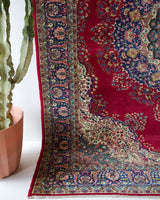 Vintage Turkish rug in a living room setting, pile rug, Turkish rug, vintage rug, portland, rug shop, bright colors, wild shaman, soft rug, bold color, Portland, Oregon, rug store, rug shop, local shop, antique rug,  carpet, ottoman design, floral carpet, traditional carpet, oriental rug