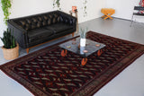 old rug, antique rug, Turkish rug, Portland, Oregon, rug store, rug shop, local shop, bright colors, wild shaman, large rug, area rug, red rug, bold color, baluch rug, burgundy, dark red