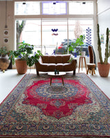 Vintage Turkish rug in a living room setting, pile rug, Turkish rug, vintage rug, portland, rug shop, bright colors, wild shaman, soft rug, bold color, Portland, Oregon, rug store, rug shop, local shop, antique rug,  carpet, ottoman design, floral carpet, traditional carpet, oriental rug