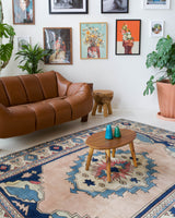 Vintage Turkish rug in living room setting, old rug, antique rug, pastel colors, faded colors, Turkish rug, vintage rug, soft rug, Portland, Oregon, rug store, rug shop, local shop