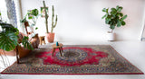 Vintage Turkish rug in a living room setting, pile rug, Turkish rug, vintage rug, portland, rug shop, bright colors, wild shaman, soft rug, bold color, Portland, Oregon, rug store, rug shop, local shop, antique rug,  carpet, ottoman design, floral carpet, traditional carpet, oriental rug