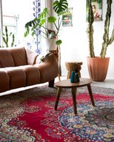 Vintage Turkish rug in a living room setting, pile rug, Turkish rug, vintage rug, portland, rug shop, bright colors, wild shaman, soft rug, bold color, Portland, Oregon, rug store, rug shop, local shop, antique rug,  carpet, ottoman design, floral carpet, traditional carpet, oriental rug