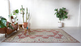 Vintage Turkish rug in living room setting, old rug, antique rug, pastel colors, faded colors, Turkish rug, vintage rug, soft rug, Portland, Oregon, rug store, rug shop, local shop
