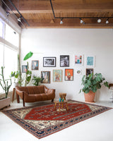 Vintage Turkish rug in a living room setting, pile rug, Turkish rug, vintage rug, portland, rug shop, bright colors, wild shaman, soft rug, bold color, Portland, Oregon, rug store, rug shop, local shop, antique rug