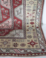 Vintage Turkish rug in living room setting, old rug, antique rug, pastel colors, faded colors, Turkish rug, vintage rug, soft rug, Portland, Oregon, rug store, rug shop, local shop