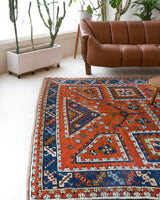 Vintage Turkish rug in a living room setting, pile rug, Turkish rug, vintage rug, portland, rug shop, bright colors, wild shaman, soft rug, bold color, Portland, Oregon, rug store, rug shop, local shop, antique rug
