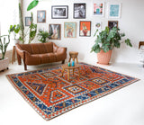 Vintage Turkish rug in a living room setting, pile rug, Turkish rug, vintage rug, portland, rug shop, bright colors, wild shaman, soft rug, bold color, Portland, Oregon, rug store, rug shop, local shop, antique rug