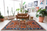 Vintage Turkish rug in a living room setting, pile rug, Turkish rug, vintage rug, portland, rug shop, bright colors, wild shaman, soft rug, bold color, Portland, Oregon, rug store, rug shop, local shop, antique rug