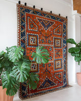 Vintage Turkish rug in a living room setting, pile rug, Turkish rug, vintage rug, portland, rug shop, bright colors, wild shaman, soft rug, bold color, Portland, Oregon, rug store, rug shop, local shop, antique rug