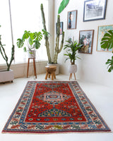 Vintage Turkish rug in a living room setting, pile rug, Turkish rug, vintage rug, portland, rug shop, bright colors, wild shaman, soft rug, bold color, Portland, Oregon, rug store, rug shop, local shop, antique rug