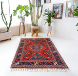 Vintage Turkish rug in a living room setting, pile rug, Turkish rug, vintage rug, portland, rug shop, bright colors, wild shaman, soft rug, bold color, Portland, Oregon, rug store, rug shop, local shop, antique rug