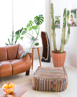Foor pouf in a living room setting, pillow, turkish pillow, kilim pillow, home decor, decorative pillow, sham, rug pillow, decor, home decor, pouf, floor cushion, cushion, Portland, rugshop, Oregon, Wild Shaman, ottoman