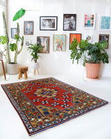 Vintage Turkish rug in a living room setting, pile rug, Turkish rug, vintage rug, portland, rug shop, bright colors, wild shaman, soft rug, bold color, Portland, Oregon, rug store, rug shop, local shop, antique rug