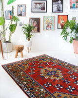 Vintage Turkish rug in a living room setting, pile rug, Turkish rug, vintage rug, portland, rug shop, bright colors, wild shaman, soft rug, bold color, Portland, Oregon, rug store, rug shop, local shop, antique rug