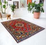 Vintage Turkish rug in a living room setting, pile rug, Turkish rug, vintage rug, portland, rug shop, bright colors, wild shaman, soft rug, bold color, Portland, Oregon, rug store, rug shop, local shop, antique rug
