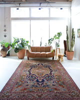 Vintage Turkish rug in a living room setting, pile rug, Turkish rug, vintage rug, portland, rug shop, bright colors, wild shaman, soft rug, bold color, Portland, Oregon, rug store, rug shop, local shop, antique rug,