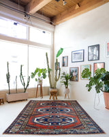 Vintage Turkish rug in a living room setting, pile rug, Turkish rug, vintage rug, portland, rug shop, bright colors, wild shaman, soft rug, bold color, Portland, Oregon, rug store, rug shop, local shop