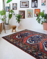 Vintage Turkish rug in a living room setting, pile rug, Turkish rug, vintage rug, portland, rug shop, bright colors, wild shaman, soft rug, bold color, Portland, Oregon, rug store, rug shop, local shop