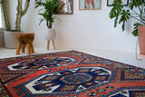 Vintage Turkish rug in a living room setting, pile rug, Turkish rug, vintage rug, portland, rug shop, bright colors, wild shaman, soft rug, bold color, Portland, Oregon, rug store, rug shop, local shop