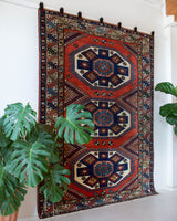 Vintage Turkish rug in a living room setting, pile rug, Turkish rug, vintage rug, portland, rug shop, bright colors, wild shaman, soft rug, bold color, Portland, Oregon, rug store, rug shop, local shop