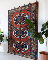 Vintage Turkish rug in a living room setting, pile rug, Turkish rug, vintage rug, portland, rug shop, bright colors, wild shaman, soft rug, bold color, Portland, Oregon, rug store, rug shop, local shop