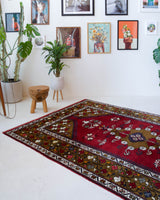 Vintage Turkish rug in a living room setting, pile rug, Turkish rug, vintage rug, portland, rug shop, bright colors, wild shaman, soft rug, bold color, Portland, Oregon, rug store, rug shop, local shop