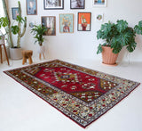 Vintage Turkish rug in a living room setting, pile rug, Turkish rug, vintage rug, portland, rug shop, bright colors, wild shaman, soft rug, bold color, Portland, Oregon, rug store, rug shop, local shop