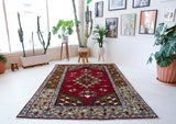 Vintage Turkish rug in a living room setting, pile rug, Turkish rug, vintage rug, portland, rug shop, bright colors, wild shaman, soft rug, bold color, Portland, Oregon, rug store, rug shop, local shop