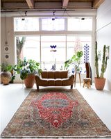 Vintage Turkish rug in a living room setting, pile rug, Turkish rug, vintage rug, portland, rug shop, bright colors, wild shaman, soft rug, bold color, Portland, Oregon, rug store, rug shop, local shop, antique rug