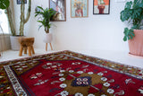 Vintage Turkish rug in a living room setting, pile rug, Turkish rug, vintage rug, portland, rug shop, bright colors, wild shaman, soft rug, bold color, Portland, Oregon, rug store, rug shop, local shop