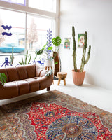 Vintage Turkish rug in a living room setting, pile rug, Turkish rug, vintage rug, portland, rug shop, bright colors, wild shaman, soft rug, bold color, Portland, Oregon, rug store, rug shop, local shop, antique rug