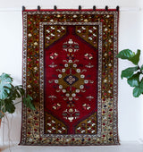 Vintage Turkish rug in a living room setting, pile rug, Turkish rug, vintage rug, portland, rug shop, bright colors, wild shaman, soft rug, bold color, Portland, Oregon, rug store, rug shop, local shop