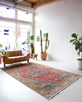 Vintage Turkish rug in a living room setting, pile rug, Turkish rug, vintage rug, portland, rug shop, bright colors, wild shaman, soft rug, bold color, Portland, Oregon, rug store, rug shop, local shop, antique rug