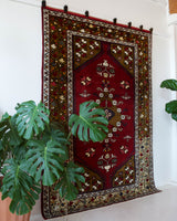 Vintage Turkish rug in a living room setting, pile rug, Turkish rug, vintage rug, portland, rug shop, bright colors, wild shaman, soft rug, bold color, Portland, Oregon, rug store, rug shop, local shop