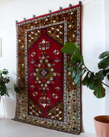 Vintage Turkish rug in a living room setting, pile rug, Turkish rug, vintage rug, portland, rug shop, bright colors, wild shaman, soft rug, bold color, Portland, Oregon, rug store, rug shop, local shop