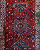 Vintage Turkish rug in a living room setting, pile rug, Turkish rug, vintage rug, portland, rug shop, bright colors, wild shaman, soft rug, bold color, Portland, Oregon, rug store, rug shop, local shop