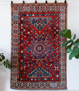 Vintage Turkish rug in a living room setting, pile rug, Turkish rug, vintage rug, portland, rug shop, bright colors, wild shaman, soft rug, bold color, Portland, Oregon, rug store, rug shop, local shop