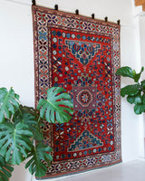 Vintage Turkish rug in a living room setting, pile rug, Turkish rug, vintage rug, portland, rug shop, bright colors, wild shaman, soft rug, bold color, Portland, Oregon, rug store, rug shop, local shop