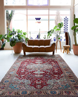 Vintage Turkish rug in a living room setting, pile rug, Turkish rug, vintage rug, portland, rug shop, bright colors, wild shaman, soft rug, bold color, Portland, Oregon, rug store, rug shop, local shop, antique rug