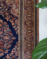 Vintage Turkish rug in a living room setting, pile rug, Turkish rug, vintage rug, portland, rug shop, bright colors, wild shaman, soft rug, bold color, Portland, Oregon, rug store, rug shop, local shop, antique rug