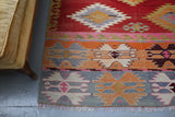 orange, green, bright color, antique, oushak rug, portland rug shop, rug store, wild shaman