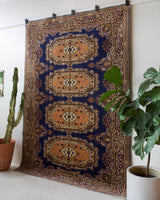 Vintage Turkish rug in a living room setting, pile rug, Turkish rug, vintage rug, portland, rug shop, bright colors, wild shaman, soft rug, bold color, Portland, Oregon, rug store, rug shop, local shop, antique rug