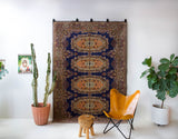 Vintage Turkish rug in a living room setting, pile rug, Turkish rug, vintage rug, portland, rug shop, bright colors, wild shaman, soft rug, bold color, Portland, Oregon, rug store, rug shop, local shop, antique rug