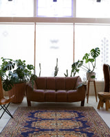 Vintage Turkish rug in a living room setting, pile rug, Turkish rug, vintage rug, portland, rug shop, bright colors, wild shaman, soft rug, bold color, Portland, Oregon, rug store, rug shop, local shop, antique rug