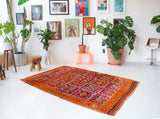 Vintage Turkish rug in a living room setting, pile rug, Turkish rug, vintage rug, portland, rug shop, bright colors, wild shaman, soft rug, bold color, Portland, Oregon, rug store, rug shop, local shop, antique rug