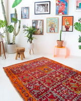 Vintage Turkish rug in a living room setting, pile rug, Turkish rug, vintage rug, portland, rug shop, bright colors, wild shaman, soft rug, bold color, Portland, Oregon, rug store, rug shop, local shop, antique rug