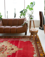 Vintage Turkish rug in a living room setting, pile rug, Turkish rug, vintage rug, portland, rug shop, bright colors, wild shaman, soft rug, bold color, Portland, Oregon, rug store, rug shop, local shop, antique rug