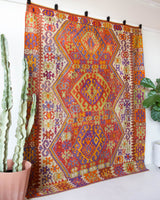 Vintage kilim rug in living room setting, bright colors, wild shaman, soft rug, bold color, Portland, Oregon, rug store, rug shop, local shop, vintage rug, modern kilim, warm colors