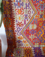 Vintage kilim rug in living room setting, bright colors, wild shaman, soft rug, bold color, Portland, Oregon, rug store, rug shop, local shop, vintage rug, modern kilim, warm colors